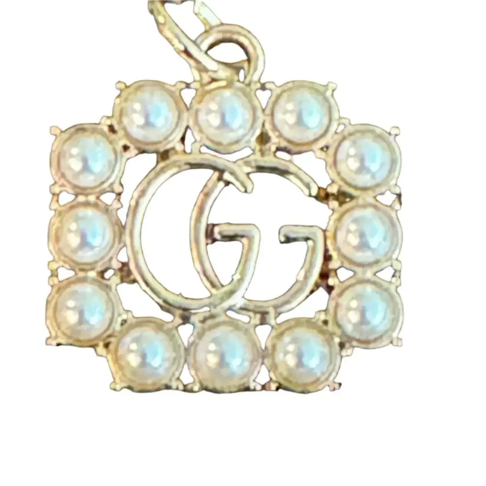 Gucci "GG" charm/zipper pull, gold tone, faux pearls, stamped Gucci_2